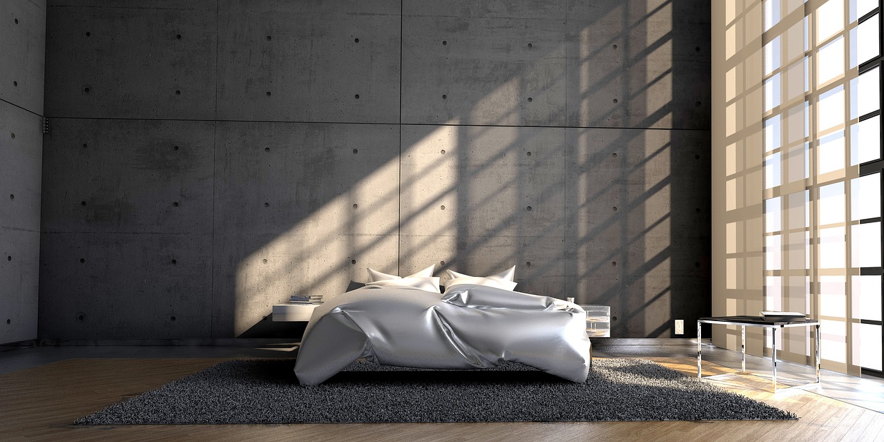 Minimalistische woonkamer met betonlook accenten.